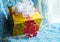 Gift in a Golden package and snowflake beautiful blue background