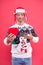 Gift with love. sexy man santa earflap hat. man funny sweater red wall. warm your heart in winter. male share his heart