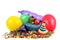 Gift packs surrounded by balloons and colorful party favors on a white background