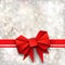 Gift paper red bow and ribbon on silver background