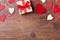 Gift or present box and mixed hearts for Valentines day background. Top view. Copy space for greeting text.