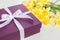 Gift, purple box with white ribbon