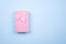 Gift rectangular pink box with bow on a pure blue background