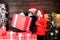 Gift from Santa Claus. Man and woman with gift boxes. Guy with big gift box. Family shopping. Surprising her. Household