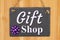 Gift Shop type message on hanging chalkboard sign with a purple bow