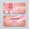 Gift voucher design template. Set of premium promotional card with realistic pink bow and silk isolated on bokeh