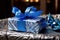 gift wrapped in blue and silver hanukkah-themed paper