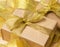 Gift wrapped in brown paper on a twisted golden ribbon background, festive background