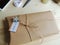 Gift wrapping. Parcel on wooden background. Small business.