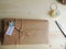 Gift wrapping. Parcel on wooden background. Small business.