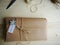 Gift wrapping. Parcel on wooden background. Small business.