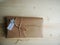 Gift wrapping. Parcel on wooden background. Small business.