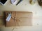 Gift wrapping. Parcel on wooden background. Small business.