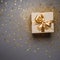 giftbox gold ribbon,space for text , decorated with glitter, generativeAI