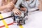 Gifted children using robot at school