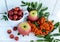 Gifts of autumn: apples, cherry plum, mountain ash on a white background. Still life in yellow, orange, red