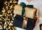 gifts boxes gold black ribbons hands woman