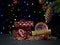 Gifts, champagne, watches and sweets on a bokeh background. Space for text.