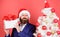 Gifts shop. Christmas gifts. Winter holidays. Boxing day. Christmas party. Man bearded hipster formal suit christmas