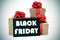 Gifts and a signboard with the text black friday