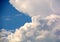 gigantic clouds on blue sky, big cumulus clouds in front of blue