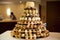 gigantic cupcake tower, with dozens of mini and classic cupcakes in variety of flavors