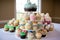 gigantic cupcake tower, with dozens of mini and classic cupcakes in variety of flavors