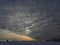 Gigantic winter storm clouds approach as sun sets