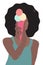 Giggling African girl with lush black hair in blue undershirt holds pink ice cream cone with three colorful balls and hides her fa