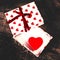 Gigt box with hearts and red ribbon. Valentines day simbols on a
