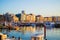 Gijon, Asturias, Spain; 09/26/2018: Sunset in the dock of Gijon, Asturias, Spain. Reflections of the boats in the water