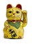 Gilded Chinese Asian or Feng Shui lucky charm cat with a paw raised in greeting denoting wealth and prosperity over a white backgr