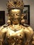 The gilded four-armed form of Avalokiteshvara Buddha statue