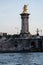 Gilded sculptures on the pillar of bridge Pont Alexandre III, Paris, France, 31. mai 2019