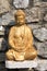 Gilded statue of Buddha on the wall of Lago di Garda, Italy