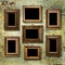 Gilded wooden frames for pictures on old rusty wall