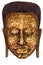Gilding to cover image Buddha with Shiny yellow leaf gold foil  to face of Buddha statue that Buddhist show to worship at the