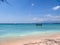 Gili Island - A boat anchored to a white sand beach