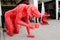 Gillie and marc gallery producing Contemporary art sculptures of rhinos and Dogs, the image shows Red dog sculpture.