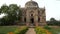 gimbal clip walking towards shish gumbad's tomb and nasturtium flowers in delhi