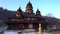 Gimbal shot of old wooden building of the Holy Prophet Elijah Monastery in the Carpathian village of Yaremche in Ukraine