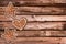 Ginger bread cookies and Christmas ornaments on wooden planks