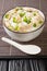 Ginger chicken Jook Rice Porridge close-up in a bowl. Vertical