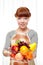 Ginger housewife holding fruits
