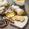 Ginger, jar of honey, dried lemon slice, cinnamon and grater