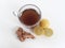 Ginger lemon tea on plain background