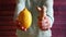 Ginger and lemon - woman hands hold tropical food ingredients for tea