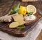 Ginger and lemon on a wooden background, Photo in a rustic style. Ingredients for warming and health drink. Alternative medicine.