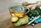 Ginger root, lime, mint, thermometer and pills on a wooden table. alternative remedy for colds and