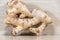 Ginger root Zingiber officinale on light and woody background
